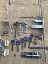 Assortment of gate-shed hardware latches hooks bolts padlock clasps