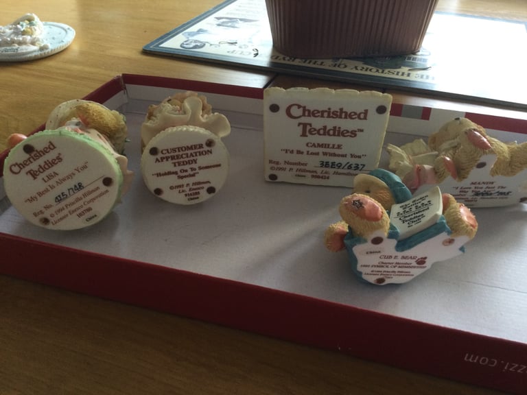 FIVE CHERISHED TEDDY ORNAMENTS.