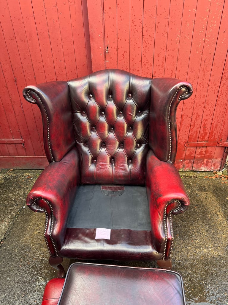 Chesterfield Leather wingback armchair and matching footstool