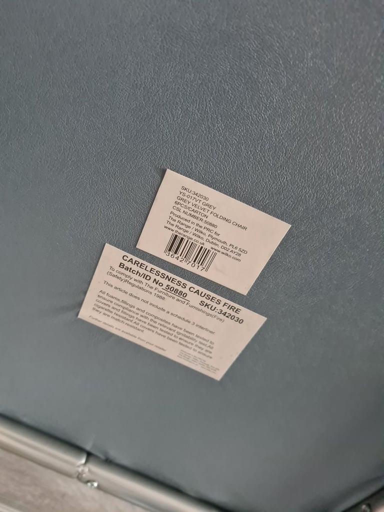 Grey foldable chair.