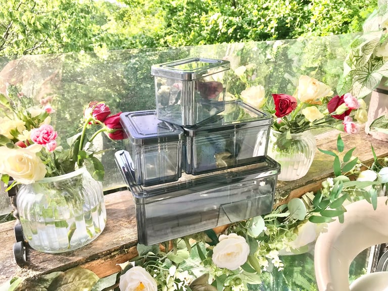 Good quality. Set of 4 Black tint plastic storage boxes Only used a few times