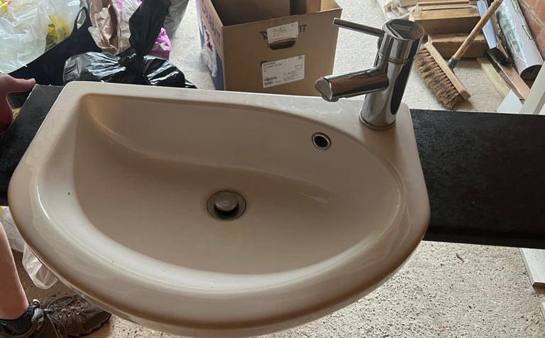WC, wash hand basin with tap, and unit