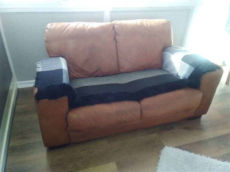 image for £20 two seater Buffalo Hide ( leather ) sofa with fire safety certificate 