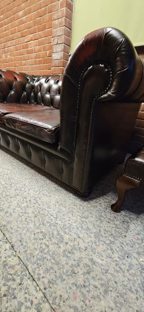 Beautiful vintage 2 seater chesterfield sofa with matching footstool.