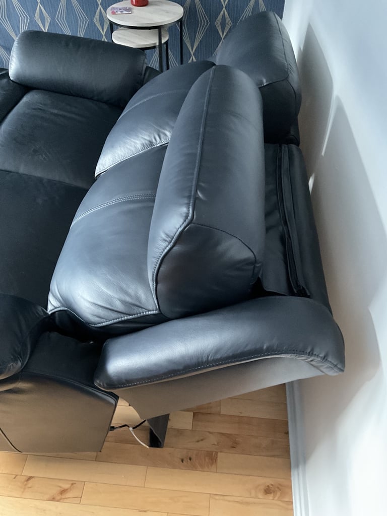 REDUCED PRICE    NEW 2 x 2 seater leather sofas 1 of which is a power recliner
