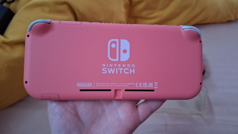 Nintendo switch lite coral pink 