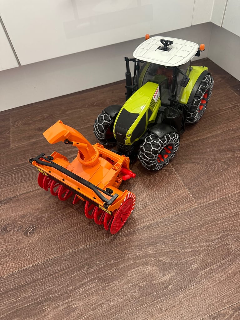 SOLD Bruder Claas Axion Tractor 950 with snow chains and snow blower