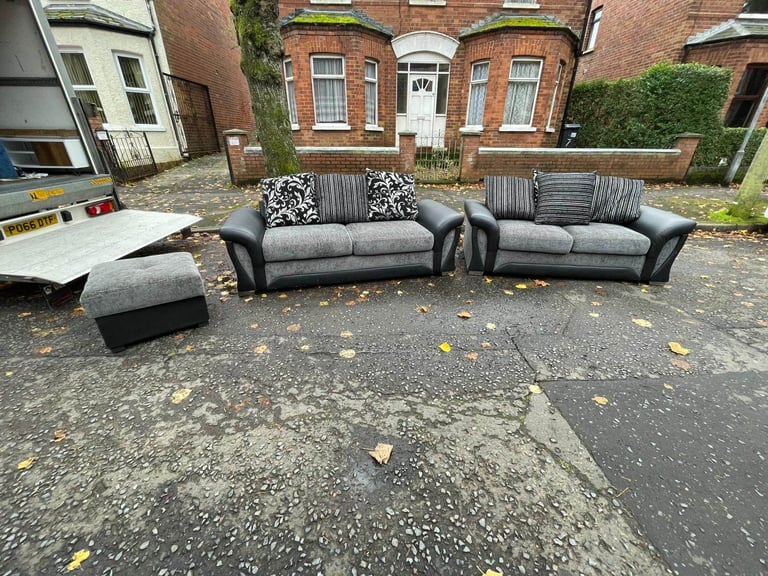 3 and 2 seater sofa in a black land grey fabric and leather couple of wee marks only £245