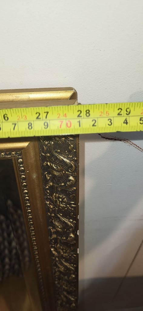 Large bevelled glass ornate  mirror  with a gold frame 