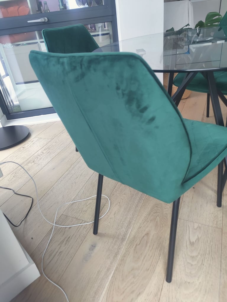 Glass table with four velvet chairs