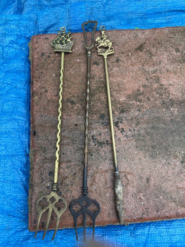 BRASS TOASTING FORKS AND A BRASS POKER