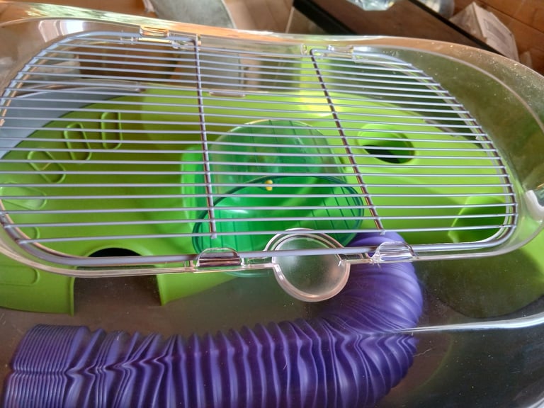 Hamster cage with wheel and tube