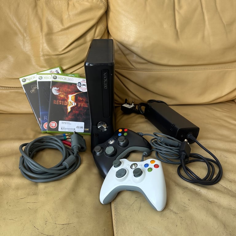 image for xbox 360 s console with 2 controllers and games