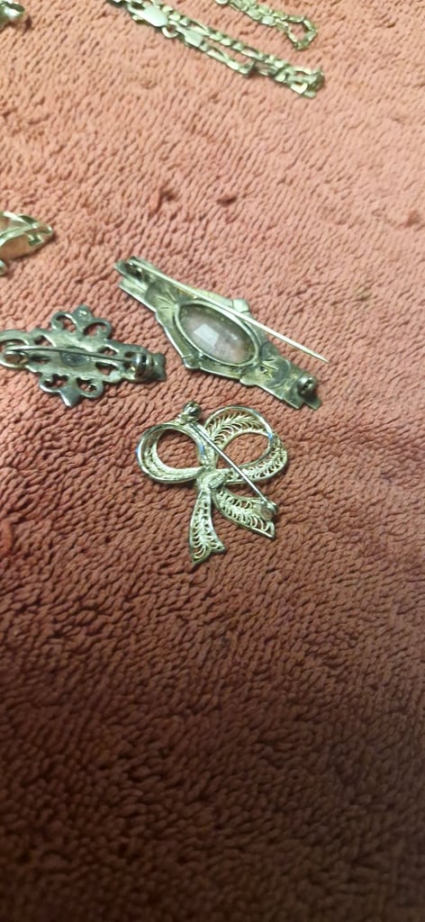 4 silver bracelets and 3 brooches