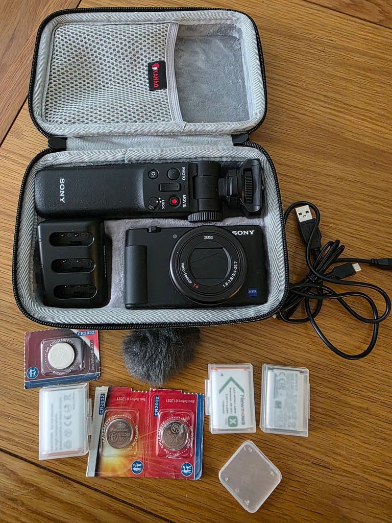 image for Sony ZV-1 vloggers camera with case, 4x batteries and  tripod camera grip