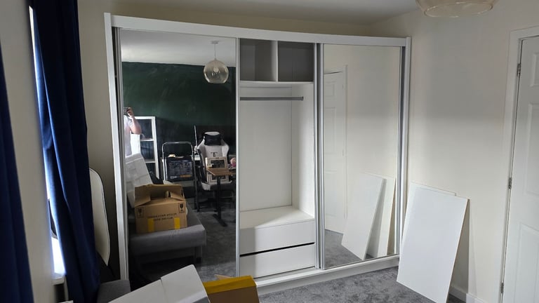 Spacious wardrobe with sliding doors