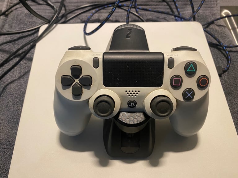 PS4 with 3 games, 1 wireless controller and docking station/charger for controller