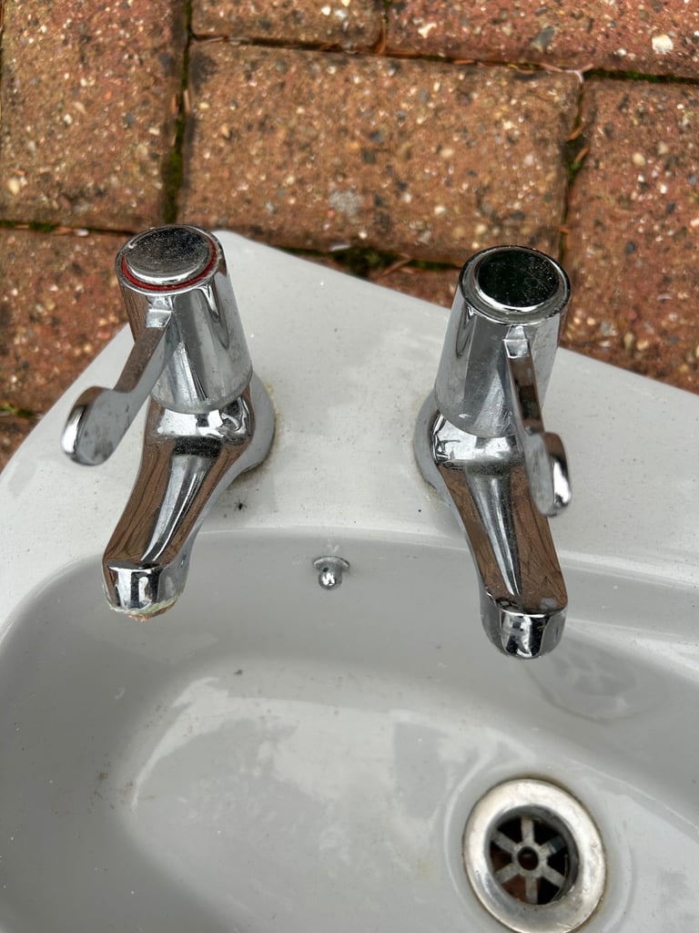 Small grey cloakroom basin sink with taps