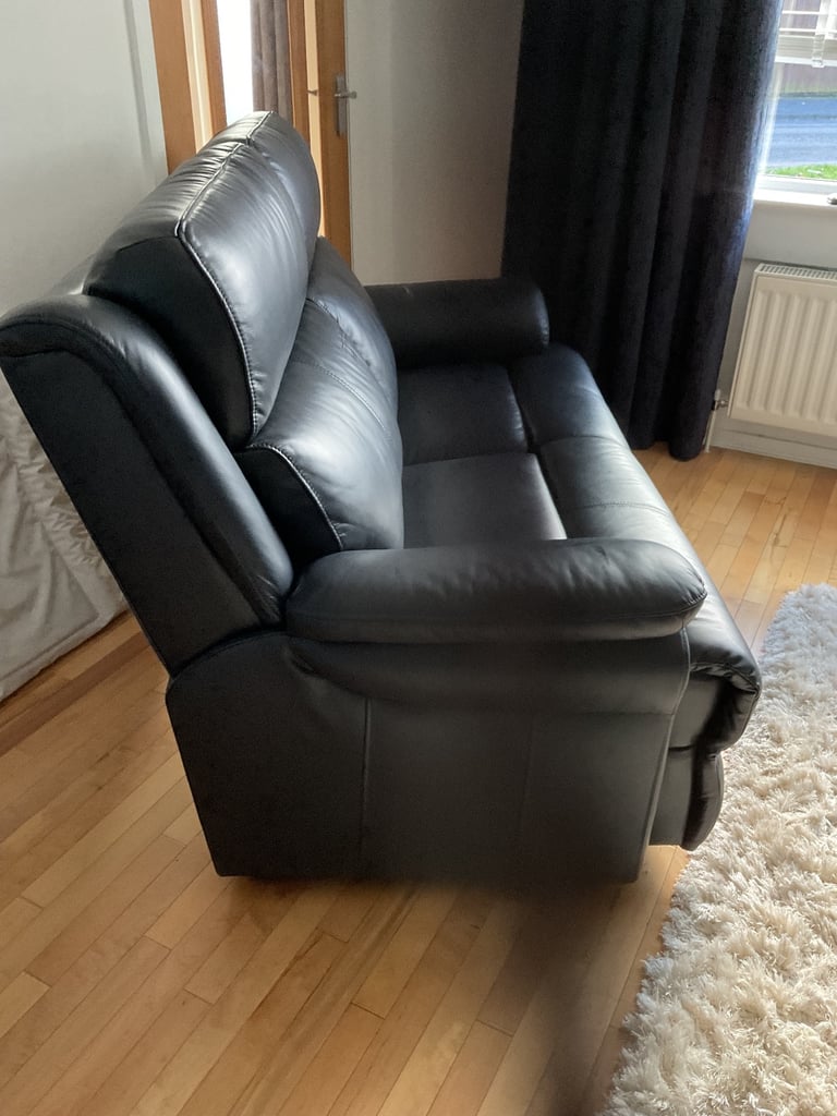 REDUCED PRICE    NEW 2 x 2 seater leather sofas 1 of which is a power recliner