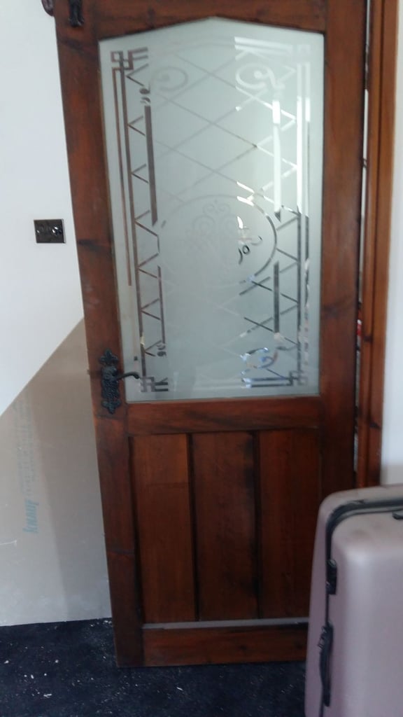 Door with etched glass bespoke made in an oak finish with handles and hinges
