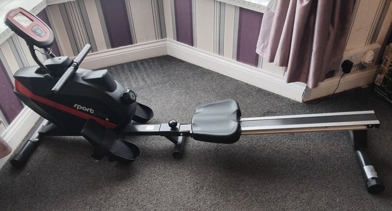 Rowing machine and weights bench