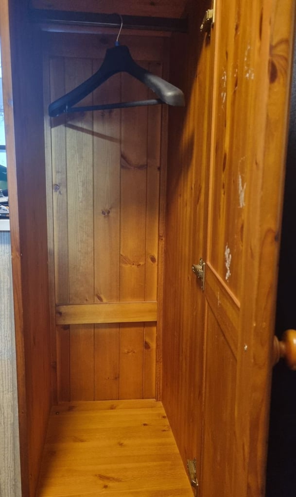 Tall slim cupboard with drawers hanging rail and separate storage 