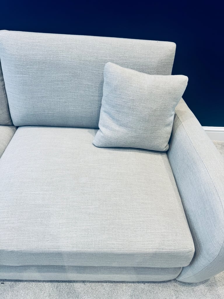 Beige three seater sofa as new