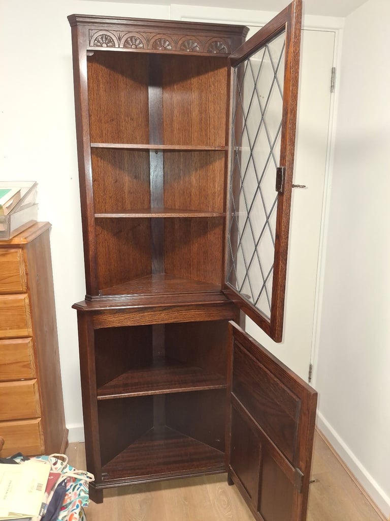 The Jaycee Vintage Oak Corner Display Cabinet is used but in very good condition.
