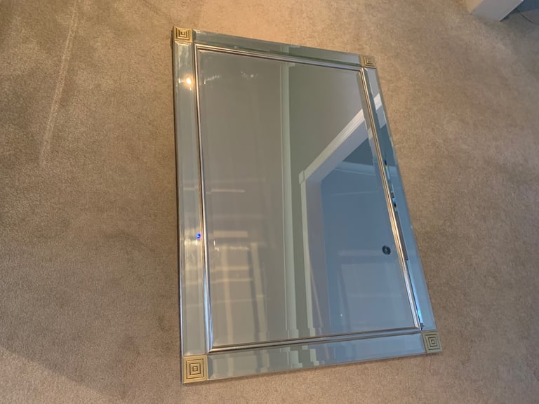 Large frameless mirror with corner detailing