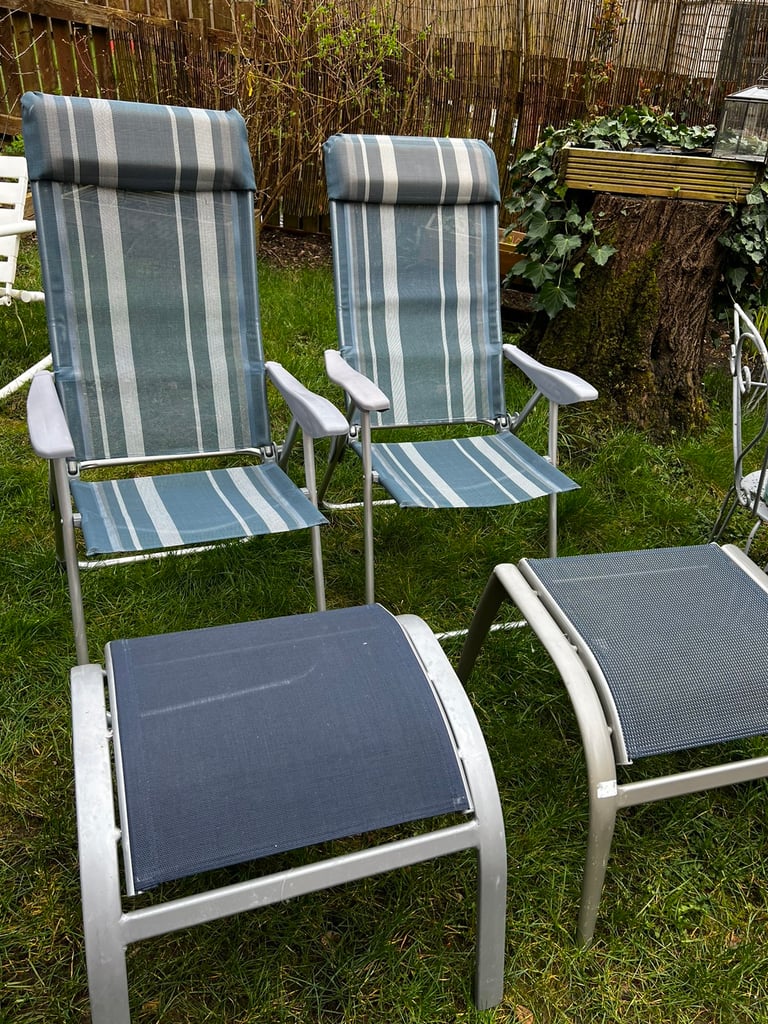 Two garden recliner chairs with 2 stools / footstools like new
