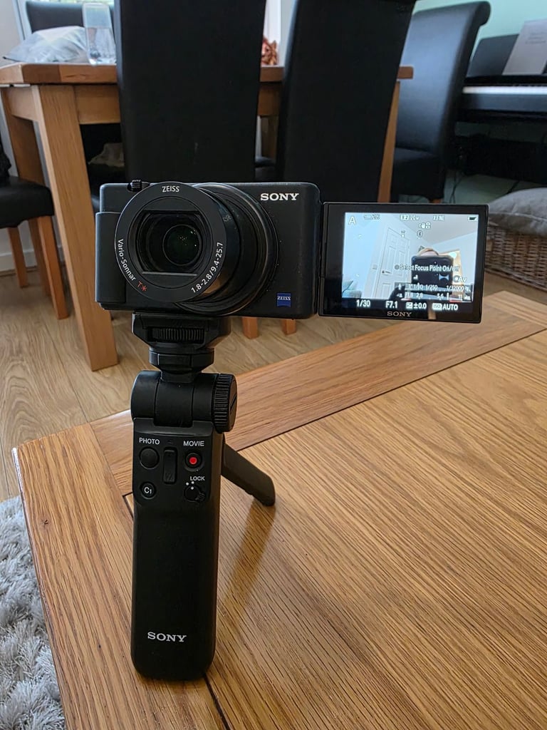 Sony ZV-1 vloggers camera with case, 4x batteries and  tripod camera grip