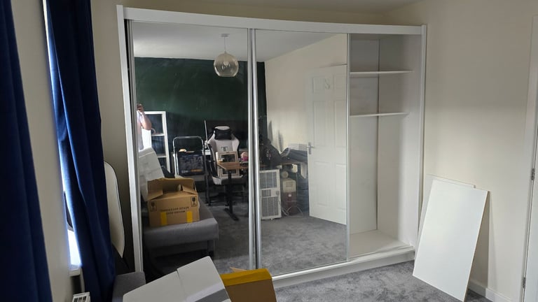 Spacious wardrobe with sliding doors