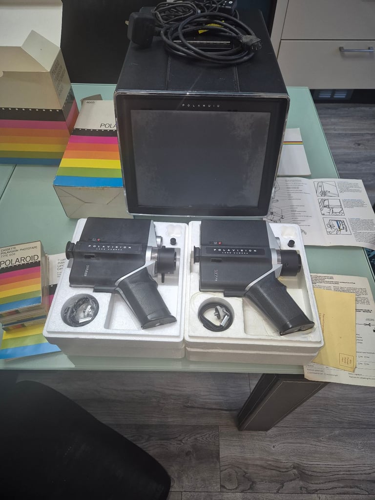 Polaroid land cameras and player screen