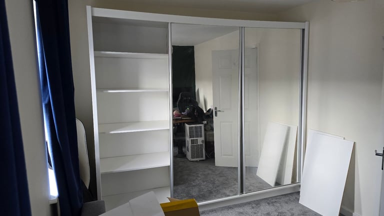 Spacious wardrobe with sliding doors