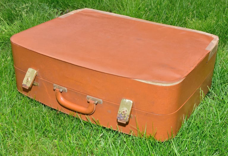Vintage (1960s) brown suitcase, well travelled and used