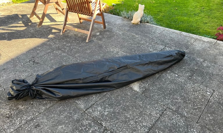 Large garden parasol with base weights and cover