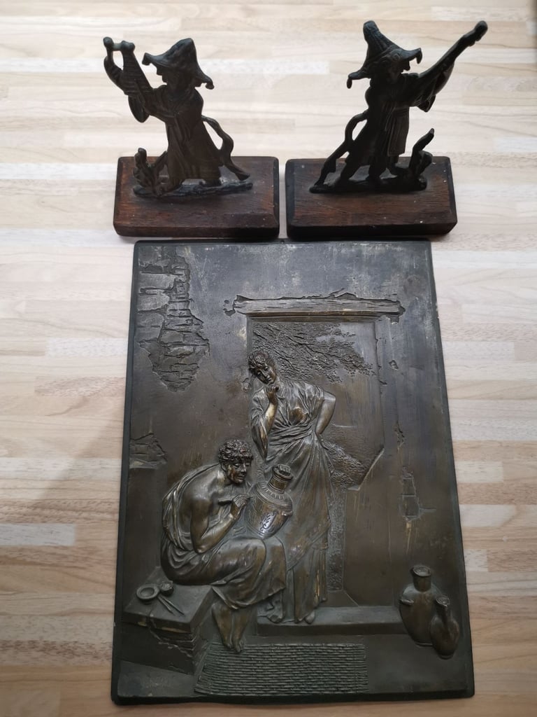Two mounted bronze 19th Century musician ornaments with a metal plaque