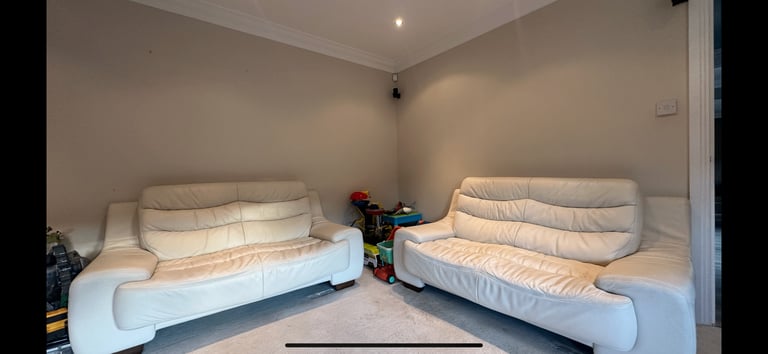 Natuzzi  2 x 2 cream leather sofas 
