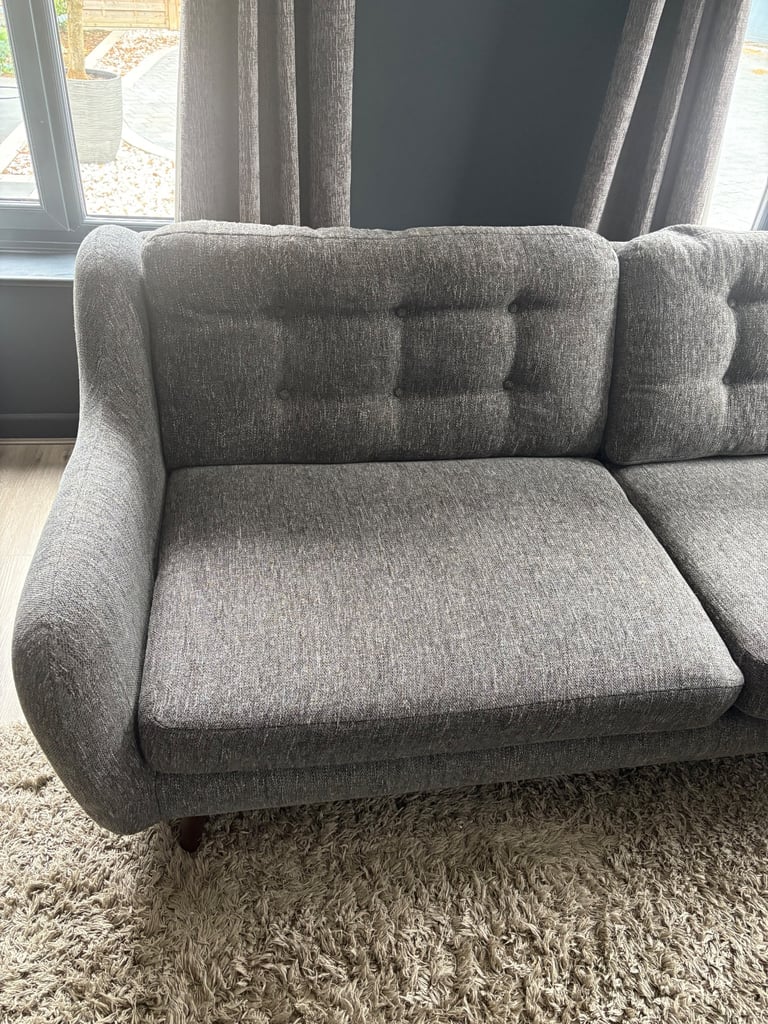 2 Four seater charcoal sofas and 2 foot stalls (DFS French connection) 