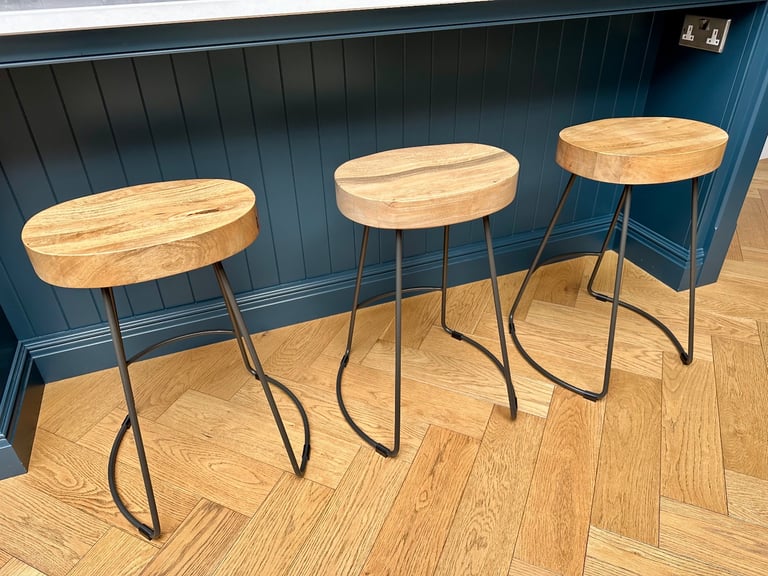 Wooden bar stools with black iron legs