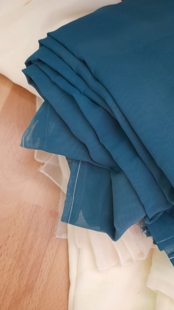 Large quantity of voile cream, teal and plum