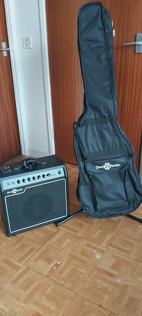 Chicago bass guitar & 15w amp, strap, stand, tuner and padded bag.