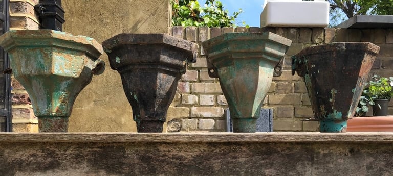 Four antique cast iron drain hoppers