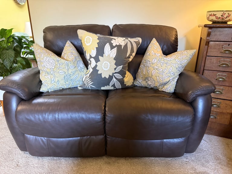 Leather two seater reclining sofa