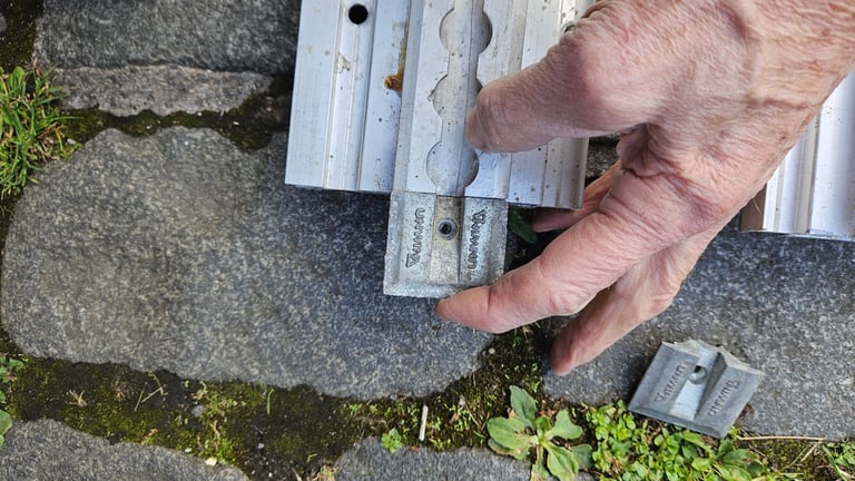 2 Unwin heavy duty floor rail tracks with clamps and end pieces.