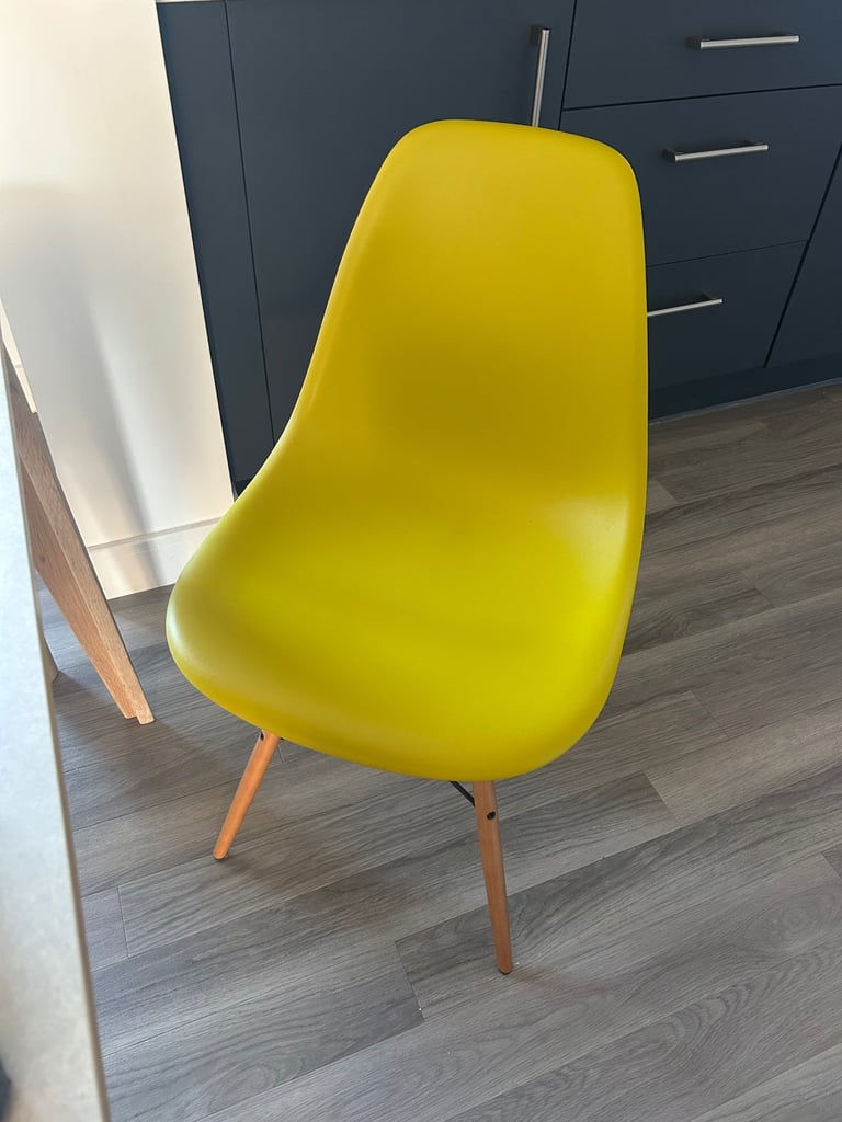 image for Vitra brand Chair in mustard yellow with wood legs 