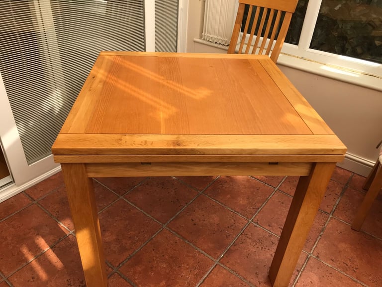 Oak extendable dining table and 4 chairs 