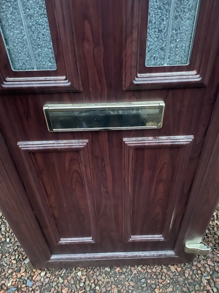 Upvc front door in rosewood 
