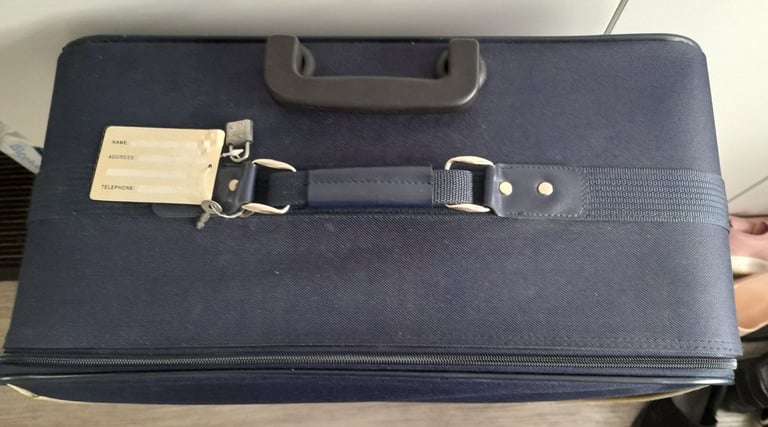 Large navy blue suitcase 32"H x 20"W x 9"D with wheels 