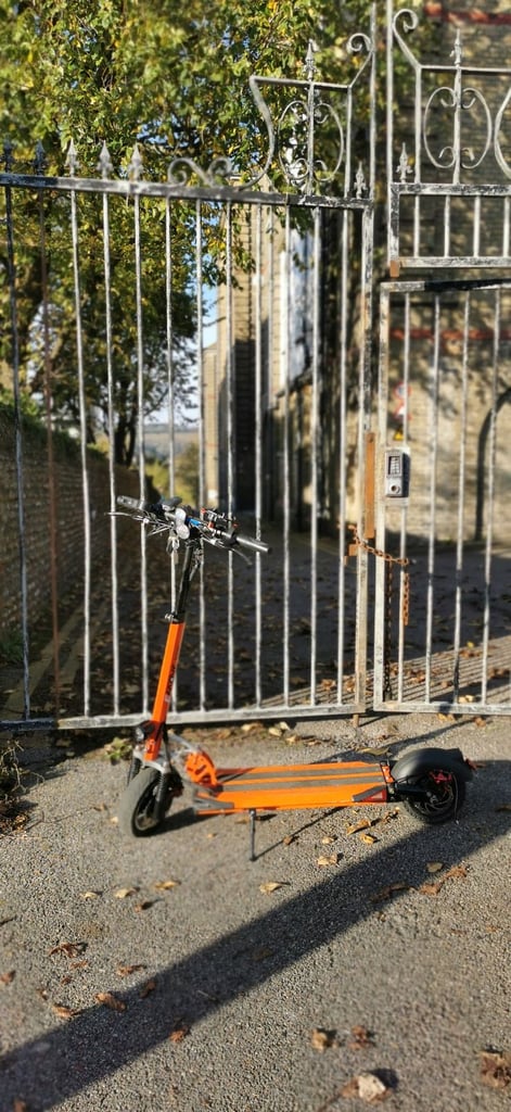 From USA an Orange electric scooter EMOVE Cruiser 'S' 52V 1600W Dual